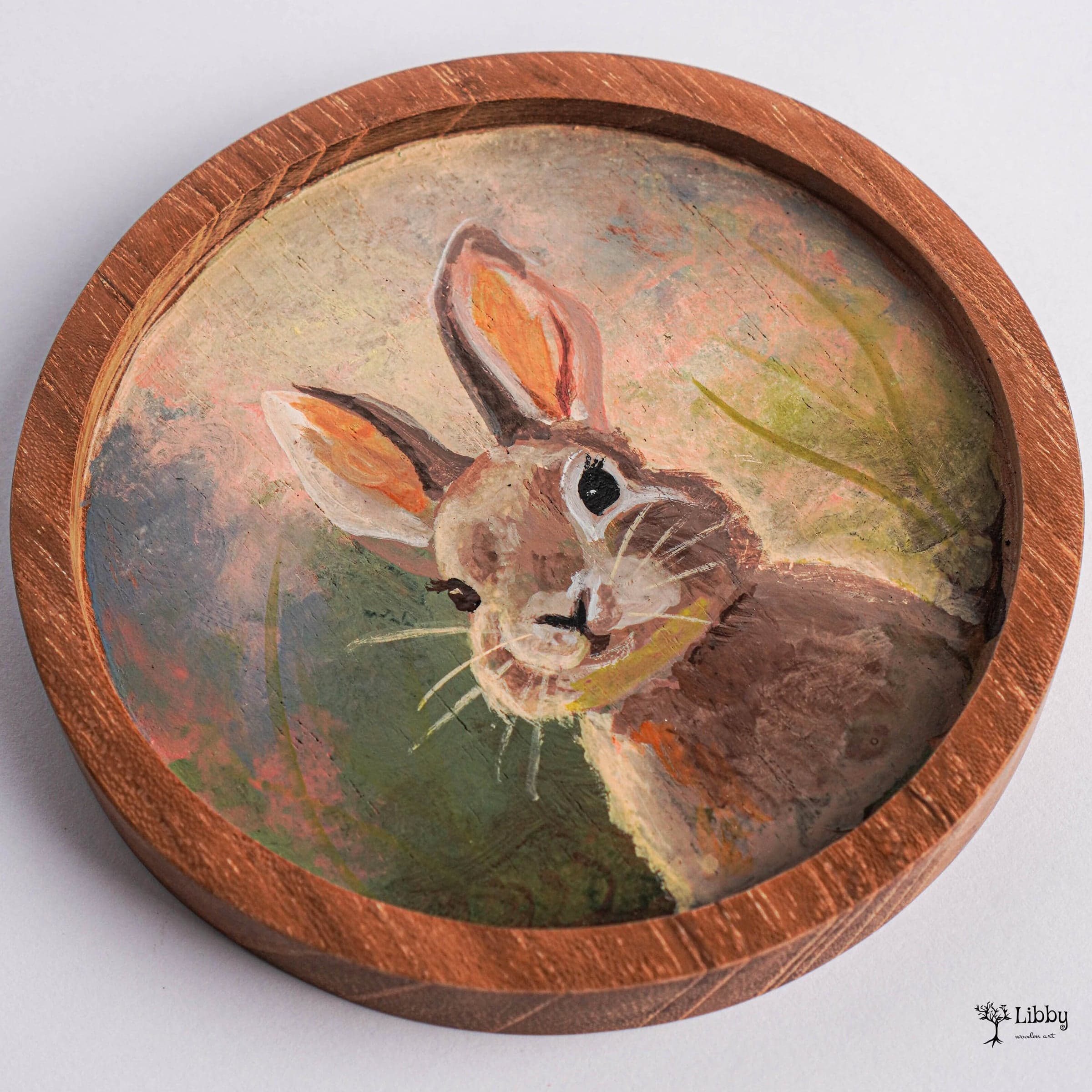 Hand-painted rabbit portrait on a round wooden frame